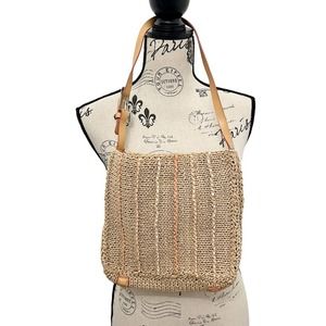 Tan unique purse by the Sak